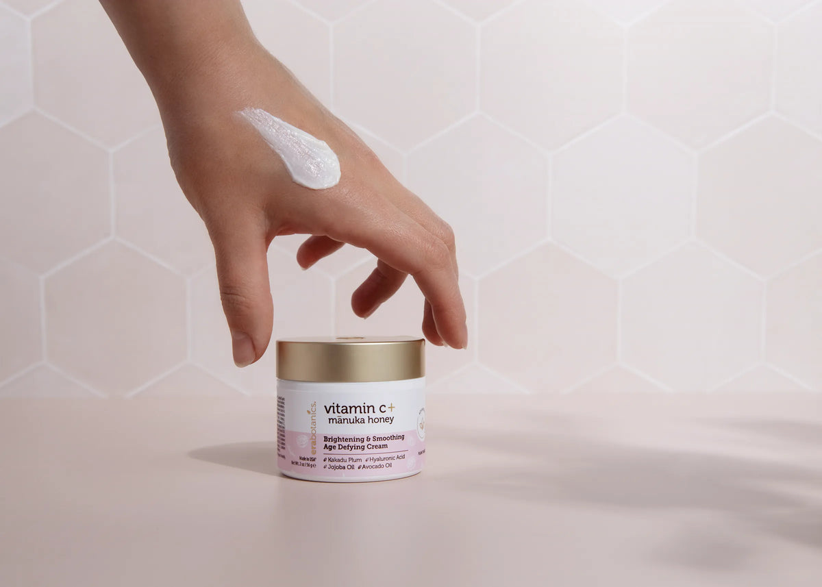 A swatch of Era Organics Vitamin C Cream above its jar