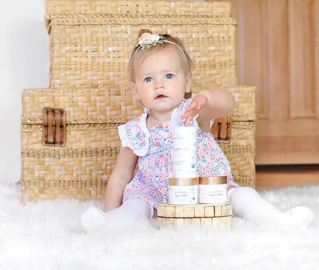 Toddler sitting with Era baby products