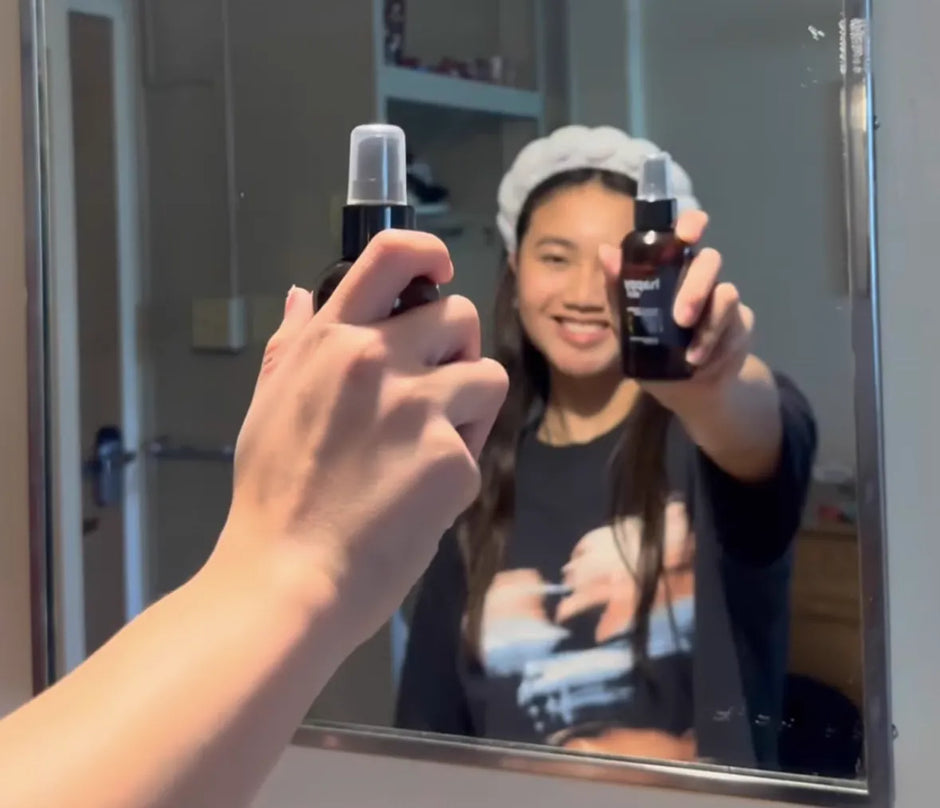Mirror selfie spraying Happy Skin